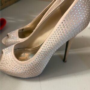 Elegant Jennifer Lopez Cream Peep-Toe Heels